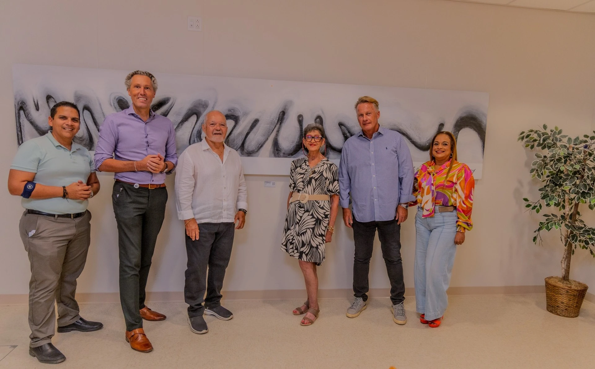 Famia Mezas cu bunita donacion di arte visual na HOH